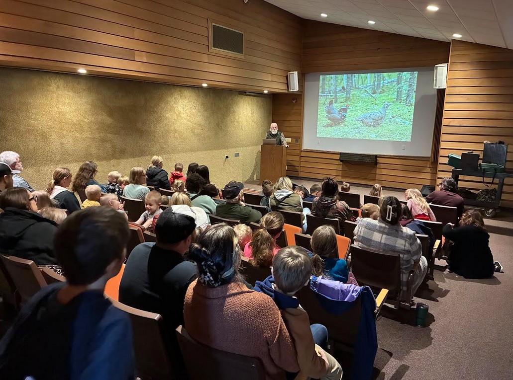 Wildlife Educator, Chris Cold shares information about special animal adaptations to the Nature Storytime participants.